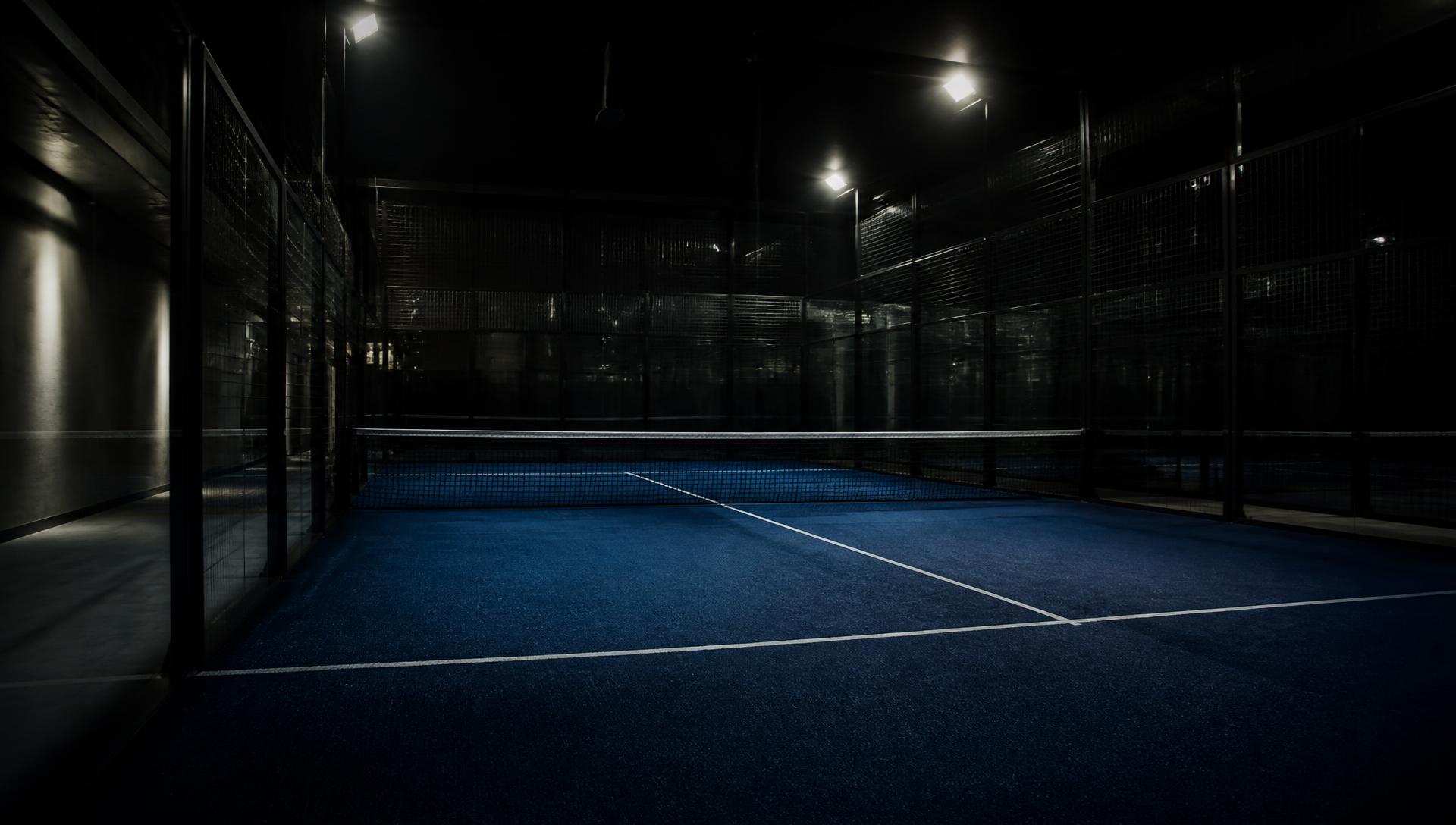 Players on an indoor padel court at Top Padel Basildon